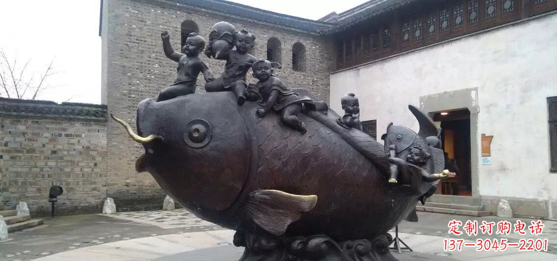 信阳小孩骑鱼铜雕